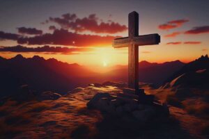 croce sul monte e tramonto